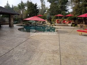 Residential remodel inlcudes mecca entertainment space for all ages using bomanite stamped concrete for the pool deck and exposed aggregate antico process for patios and outdoor living areas