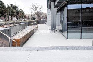 50 Fifty DTC incorporates Bomanite Sandscape Refined Exposed Aggregate for the decorative concrete curbs and walkways and under the porte cochere installed by Colorado Hardscapes in Denver, CO to bring the Nautical Design to life
