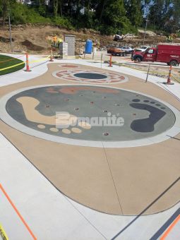 Musselman & Hall Contractors, LLC finished the work needed on the Community Park in Jefferson City, Mo with colorful concrete using the Bomanite Sandscape Texture Exposed Aggregate System with Bomanite Con-Color for a fun splash pad for everyone to enjoy.