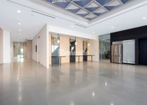 Elegance and sophistication abound inside the Healthpeak Properties office, where the Bomanite Modena Monolithic cementitious topping was installed to create a stunning flooring surface.